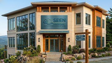 Modern two-story building with large windows and a SEEN sign at the entrance