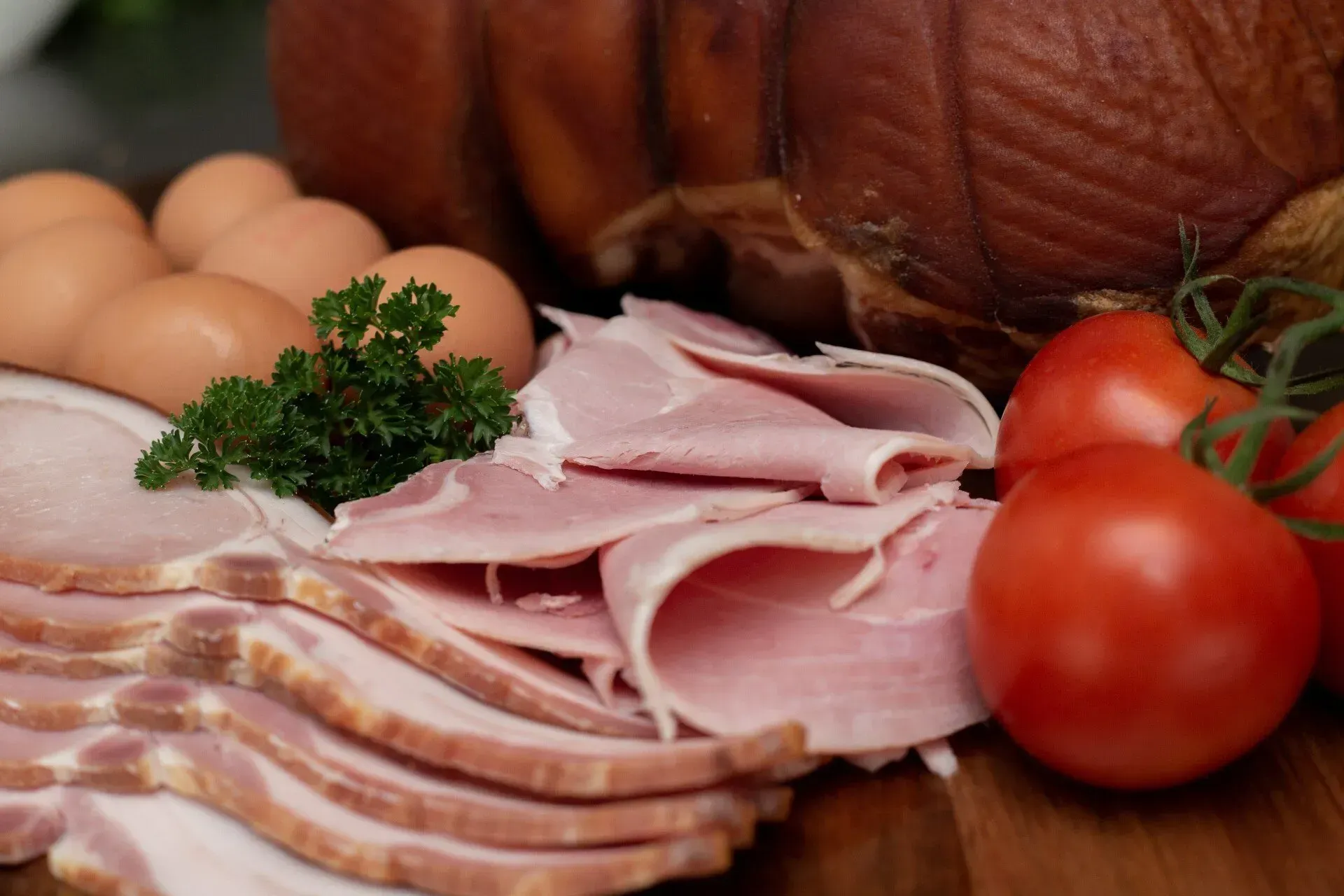 Close-up of Breakfast Ingredients: Sliced Ham, Bacon, Eggs, Tomatoes — Lighthouse Meat & Poultry In Port Macquarie, NSW