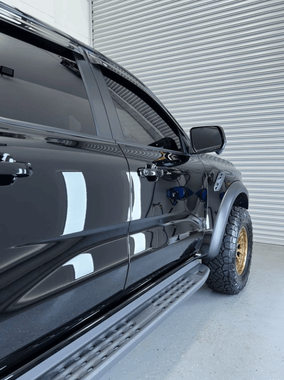 A black ute with a ceramic film window tint installed.