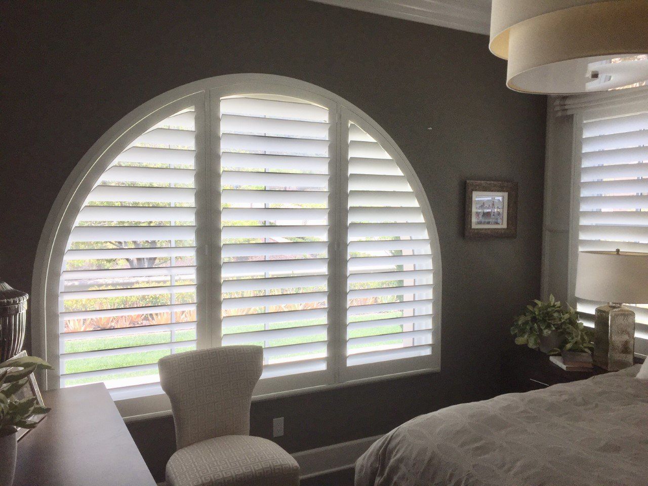 Arched Woodlore Plus Shutter in Rancho Bernardo, CA bedroom.
