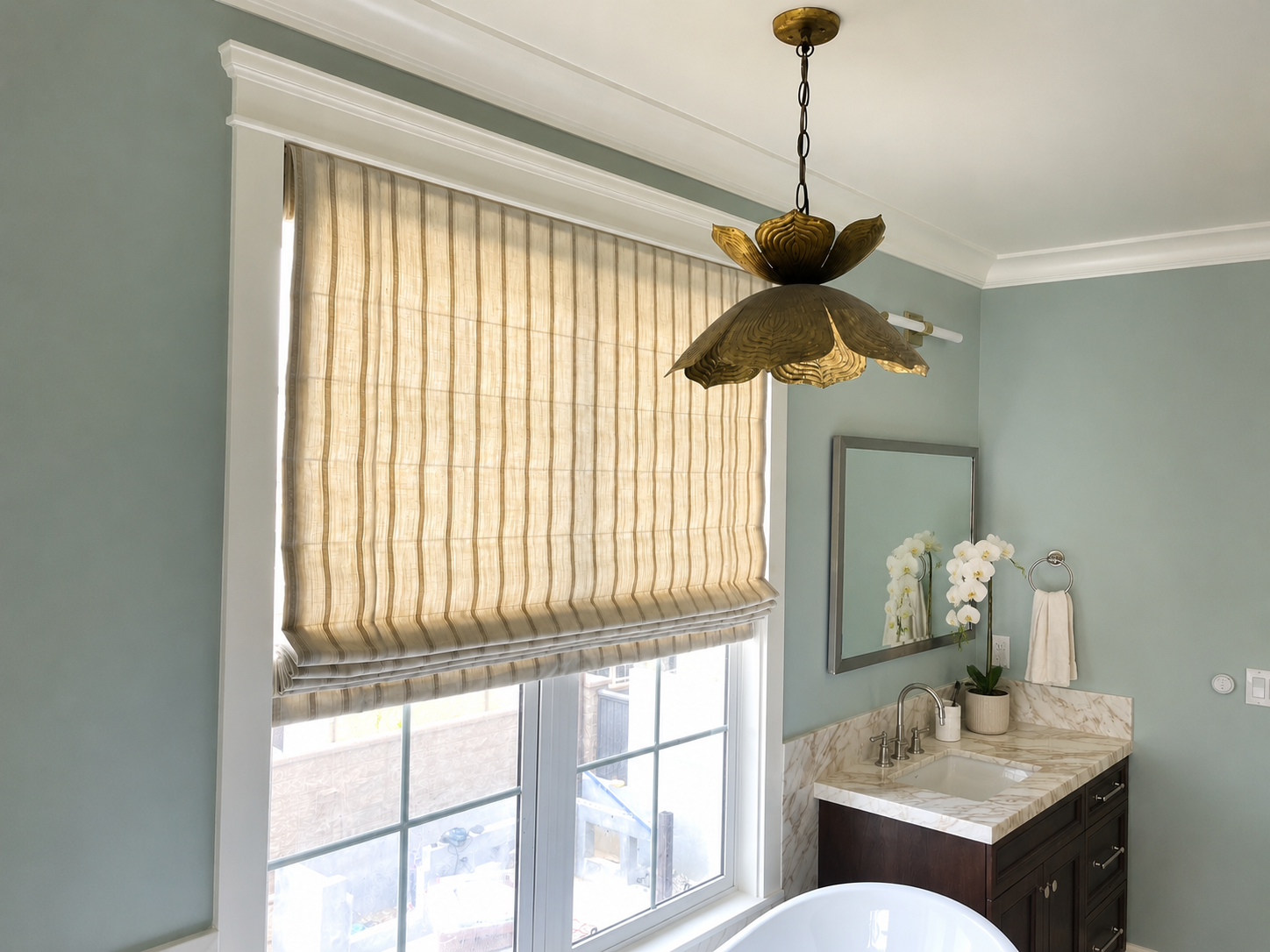 Bathroom flat motorized roman Shade in Carlsbad remodel project by window spaces