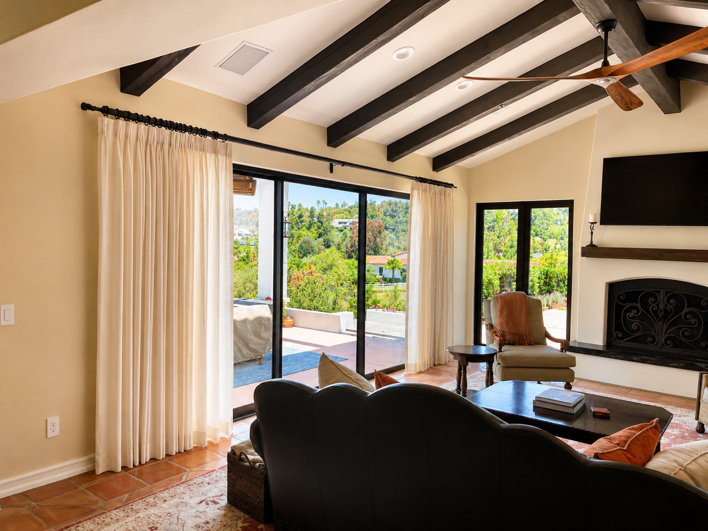 Inverted pleat draperies in Spanish Modern living room in Del Mar CA