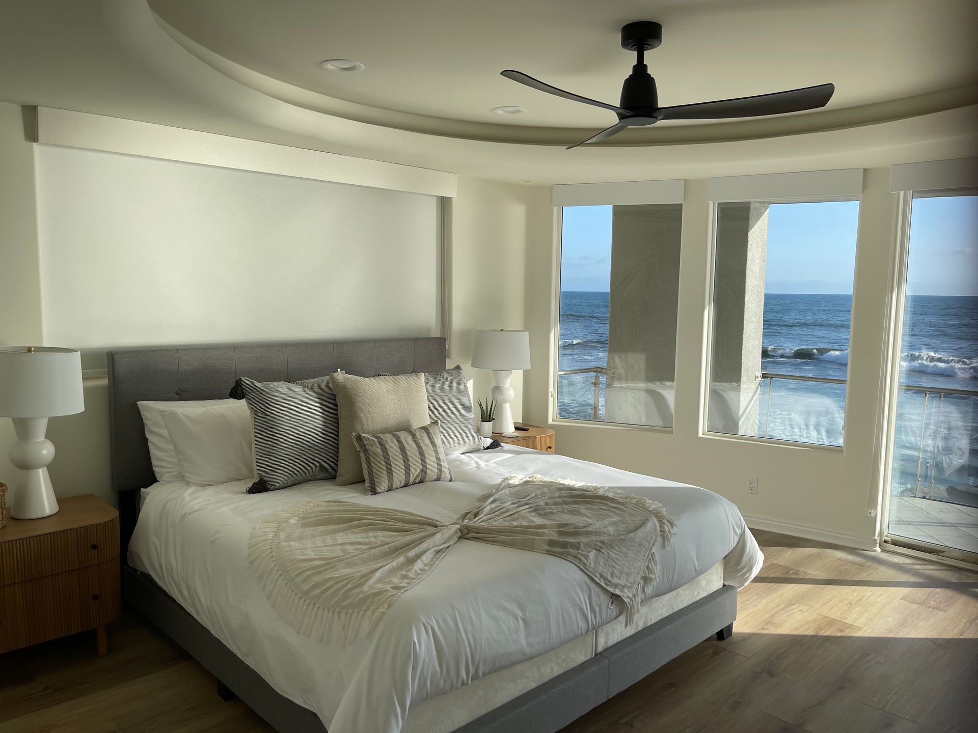 Blackout roller shades in primary bedroom in ocean front home in Oceanside, CA