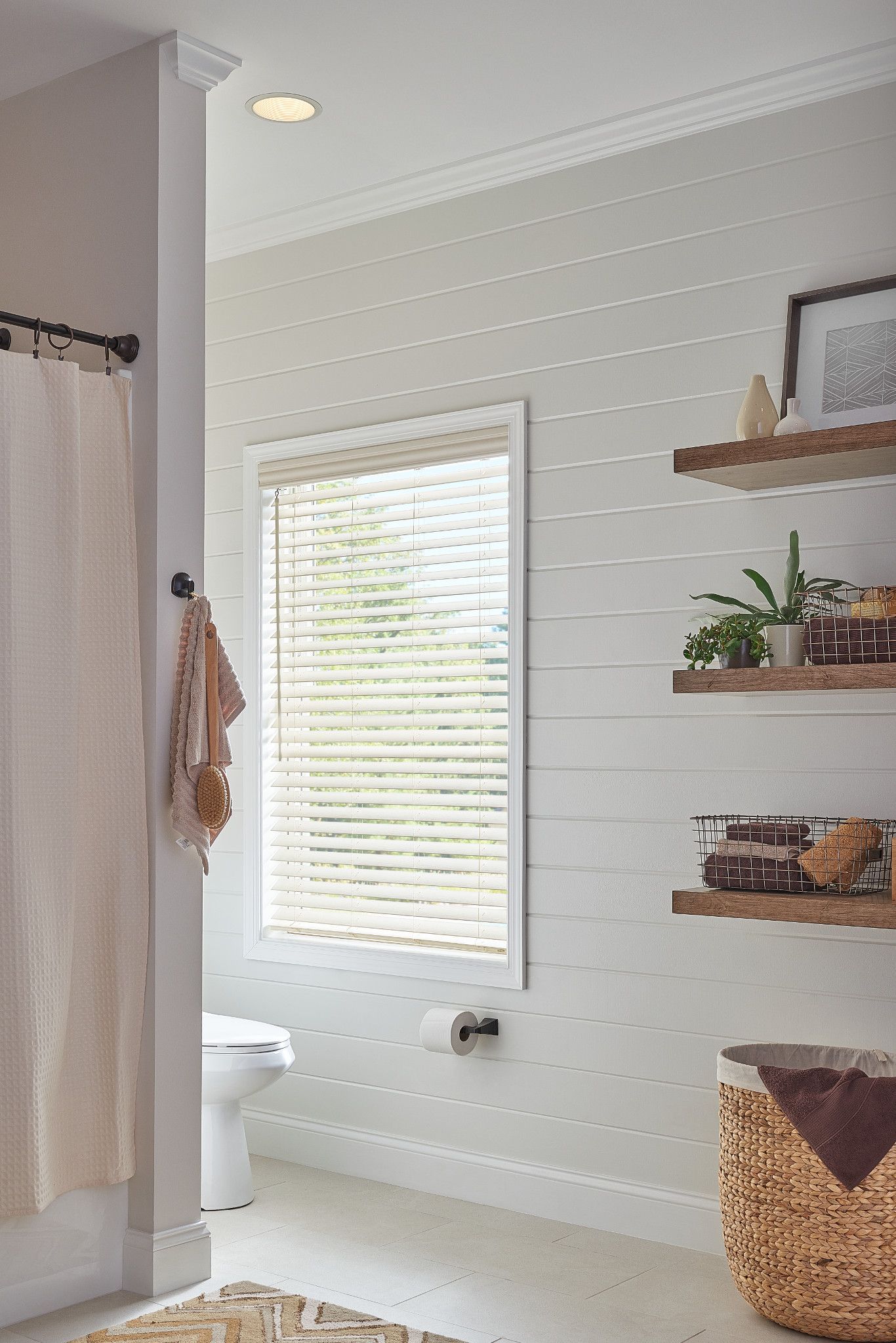 Faux wood blinds for Carlsbad, CA laundry room for sun and moisture resistance.