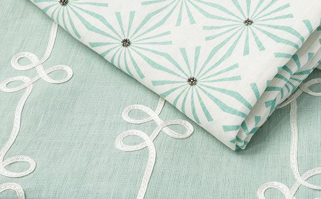 green fabric with a pattern on them.