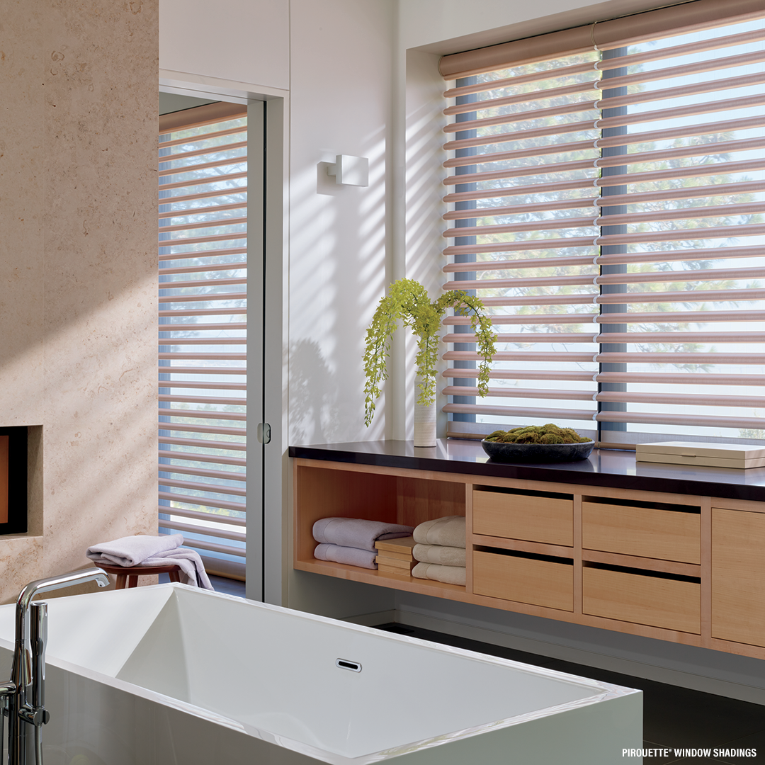 Hunter Douglas Pirouette Shades in A bathroom with a tub and a window with blinds