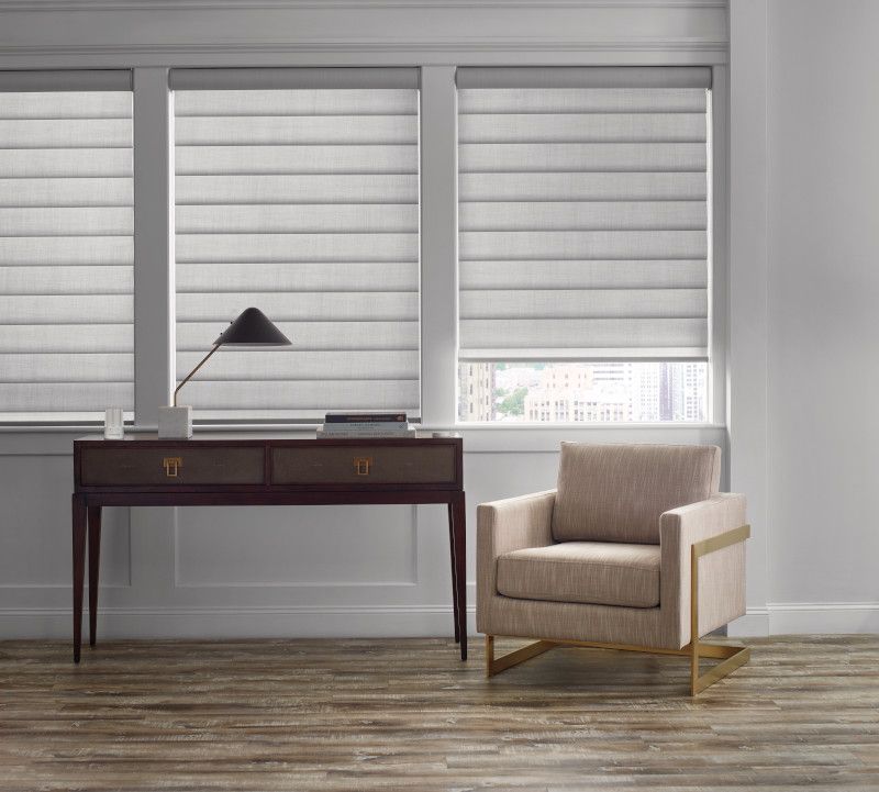 Beautiful PIROUETTE® Window Shadings and desk.