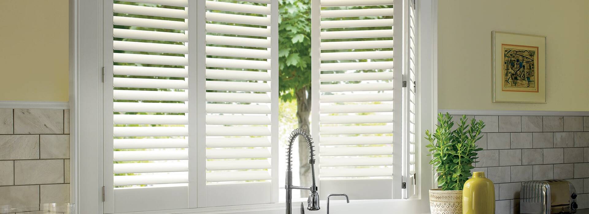 Window Shutters in kitchen sink window.