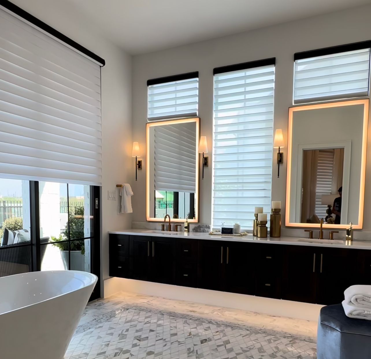 A bathroom with two sinks and two mirrors