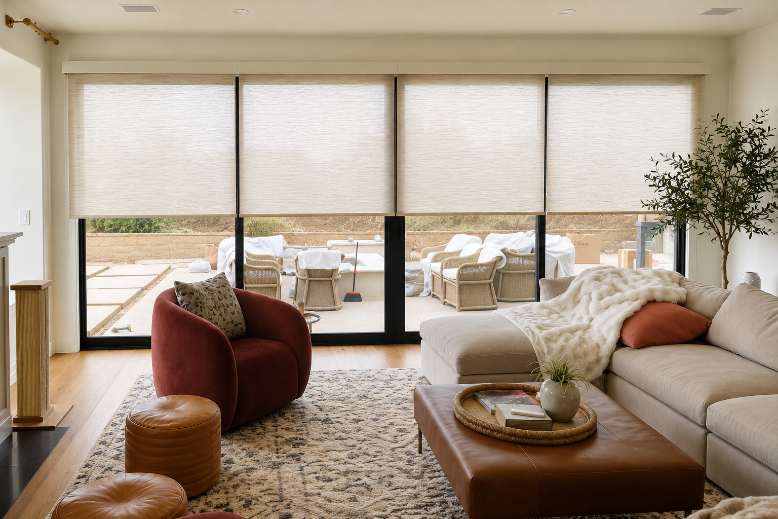 Somfy motorized solar shades in living room for a remodel home project by window spaces