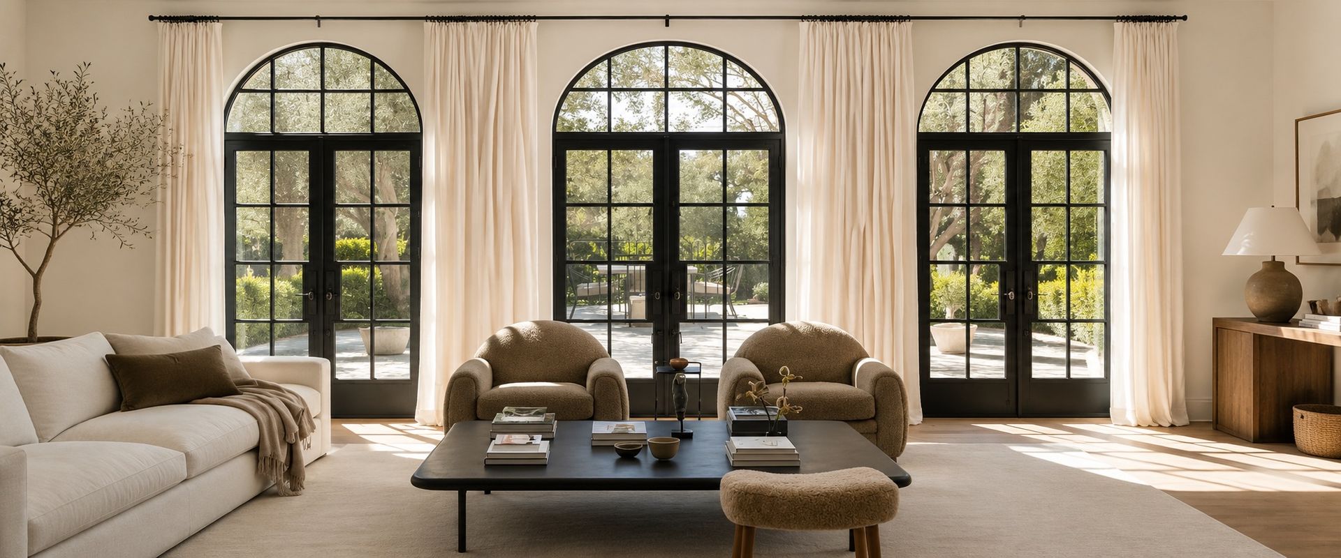 arched windows with white custom drapery and matte black hardware in living room, San Marcos, CA