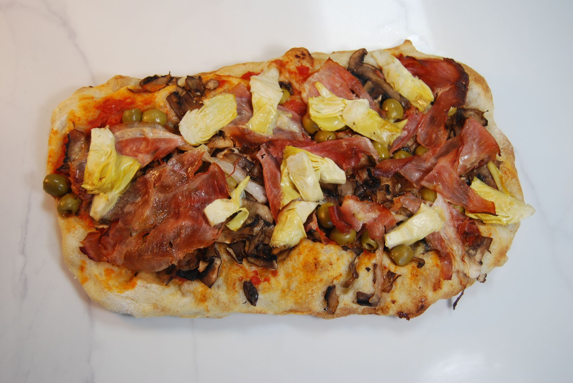 A pizza with a lot of toppings on it