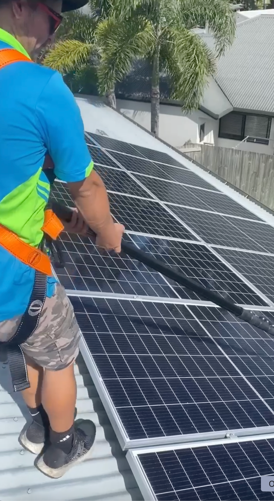 A Row of Solar Panels on a Tiled Roof — Pain in the Glass Window Cleaning in Proserpine, QLD