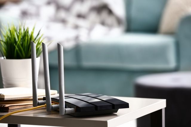 A Router Is Sitting On A Table In A Living Room — Comms Cabling Central Coast In Kanwal, NSW
