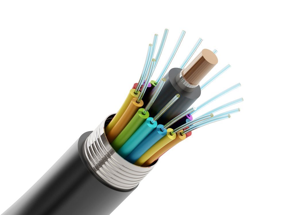 A Close Up Of An Optical Fiber Cable On A White Background — Comms Cabling Central Coast In Kanwal, NSW