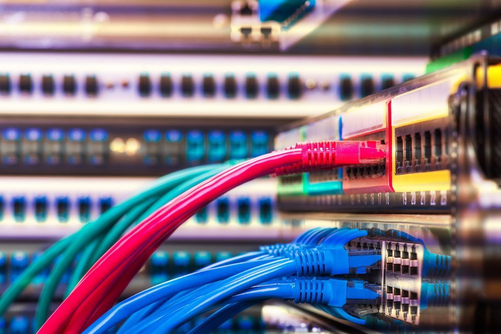A Bunch Of Wires Are Connected To A Server In A Data Center — Comms Cabling Central Coast In Kanwal, NSW