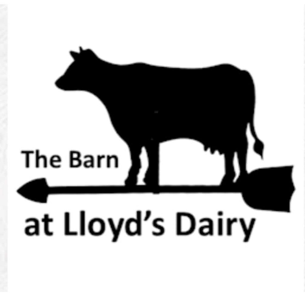 Black cow silhouette over text reading “The Barn at Lloyd’s Dairy” with an arrow logo