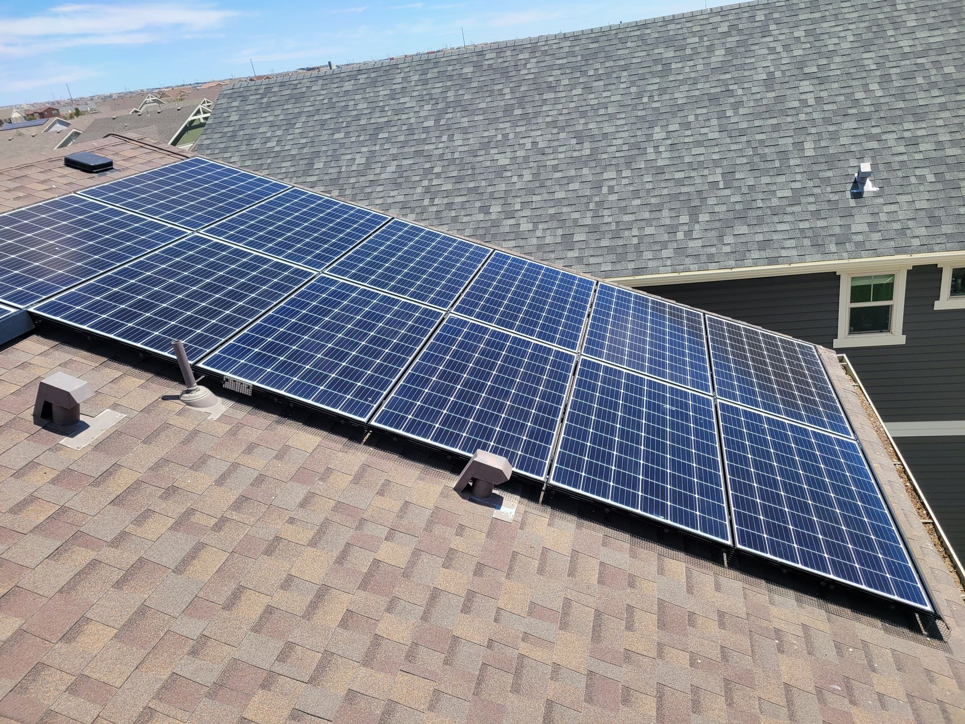 A roof with a lot of solar panels on it