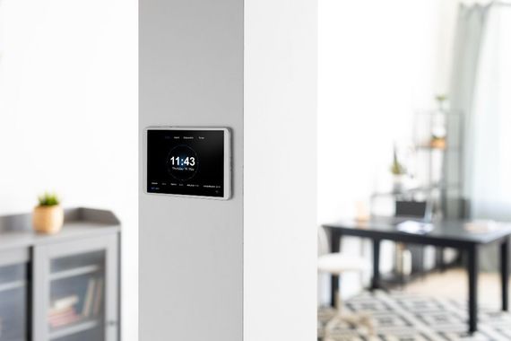 Honeywell thermostat displaying 77 degrees, set to 93 degrees, with 