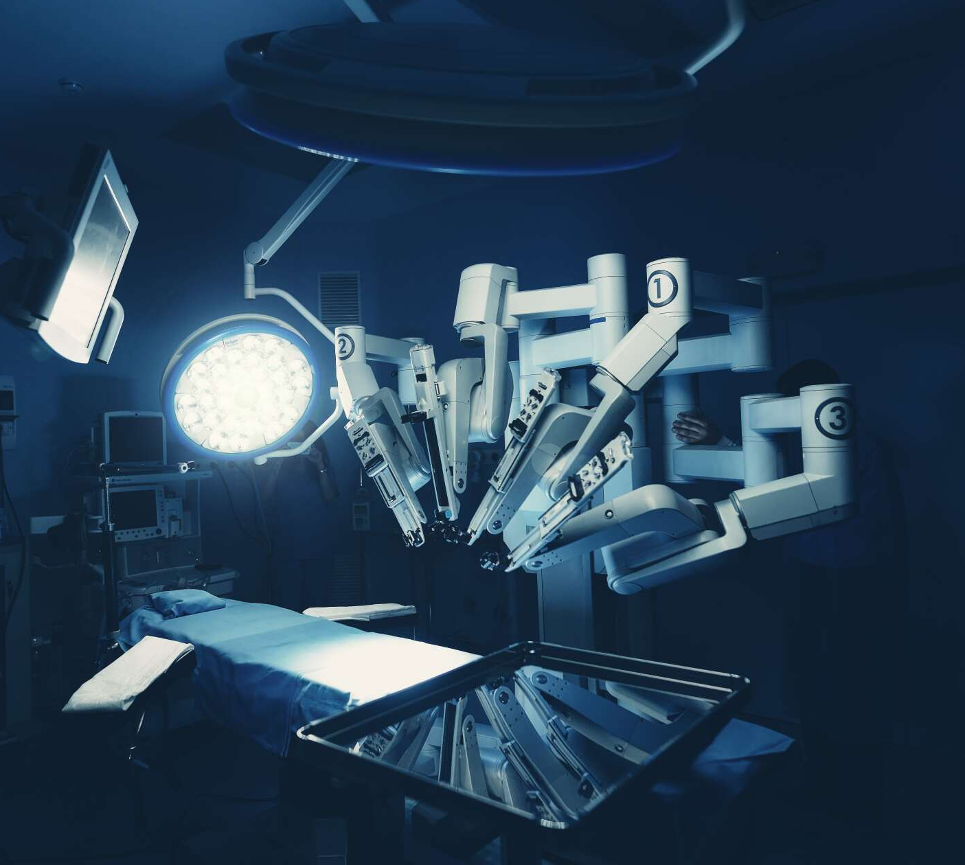 An operating room with a robotic arm that has the letter d on it