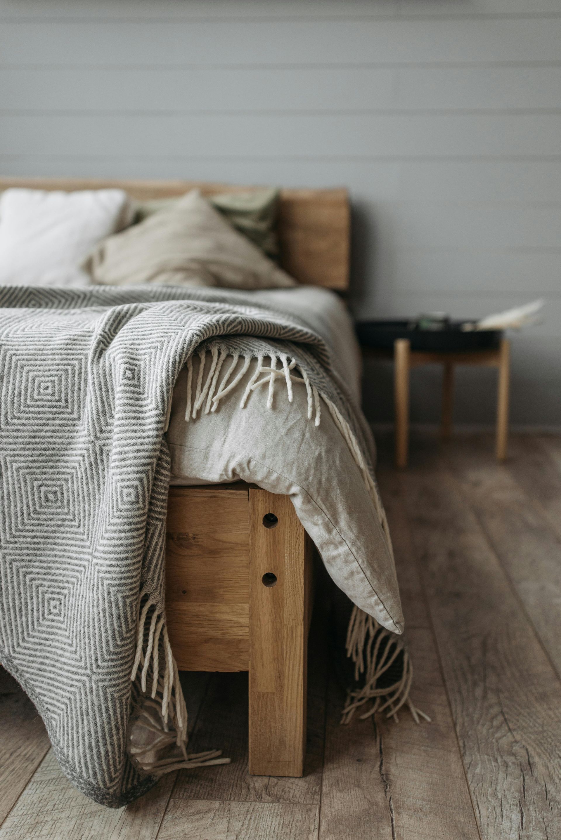 cozy bedroom with close up of bed with a warm winter blanket on it