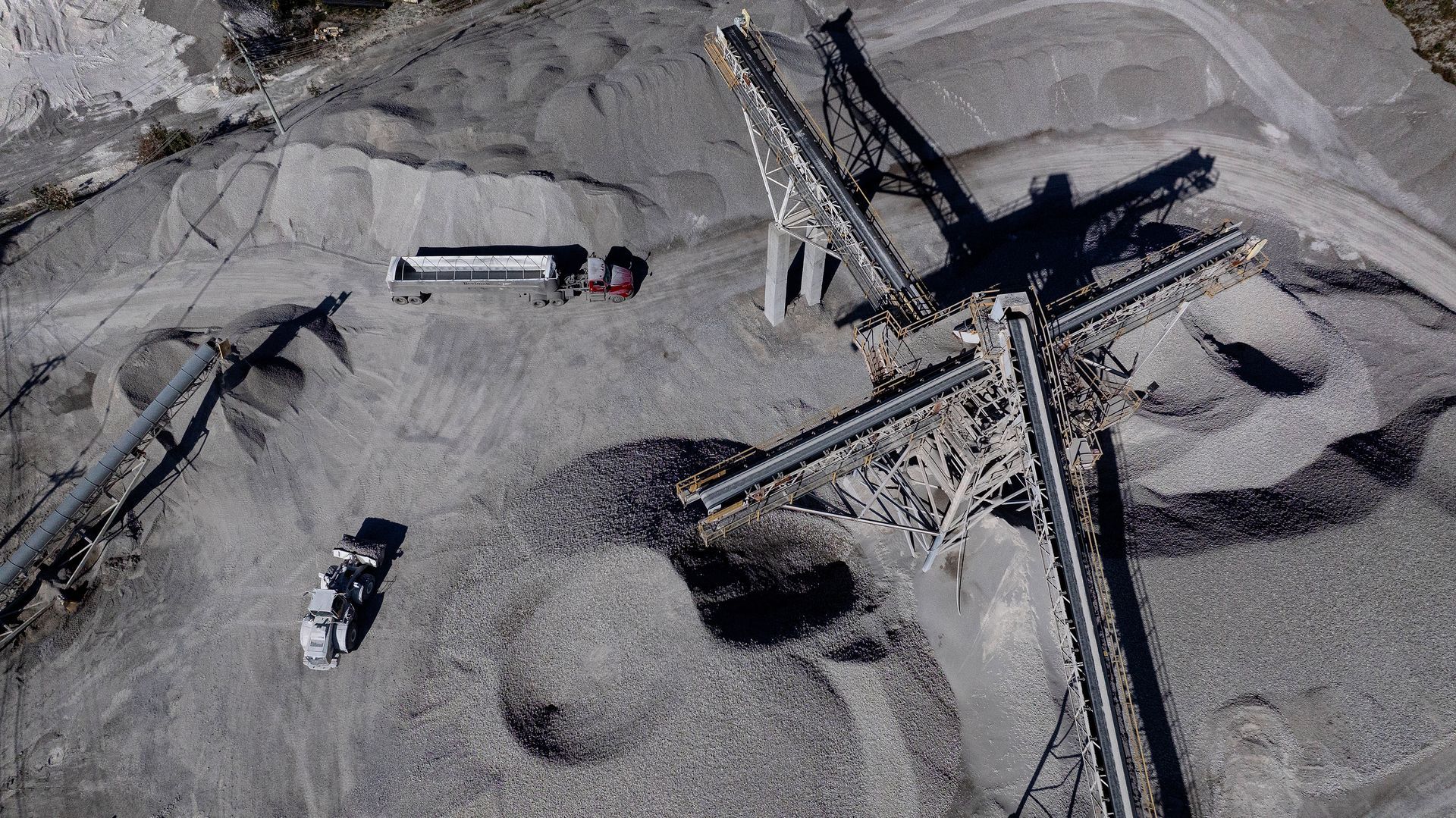 Aerial drone photography documenting extensive manufacturing facility operations, showcasing industrial scale and logistics infrastructure from an elevated perspective.
