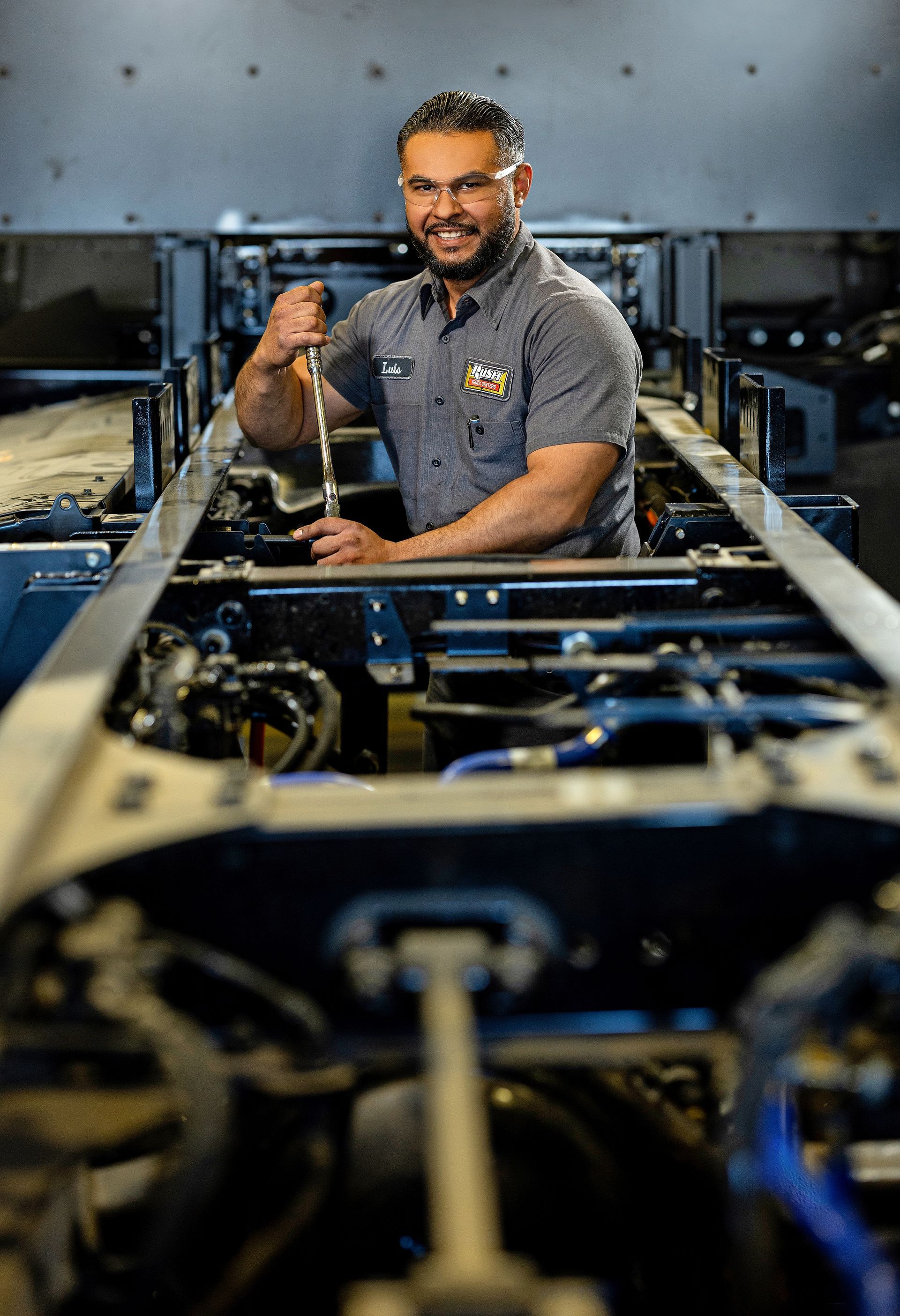 Skilled industrial fabricator operating precision metalworking machinery.