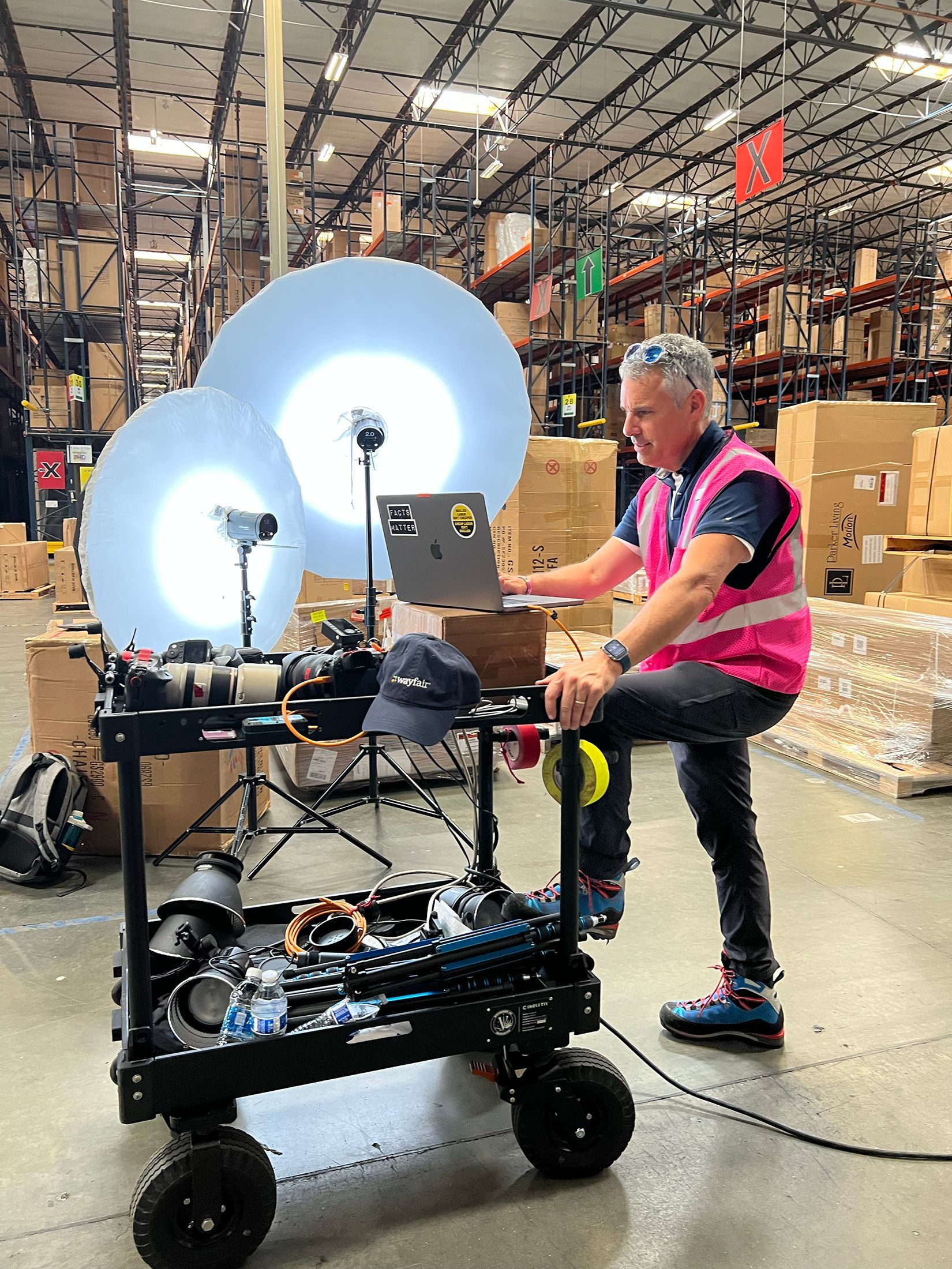 Commercial photographer working in a manufacturing facility.