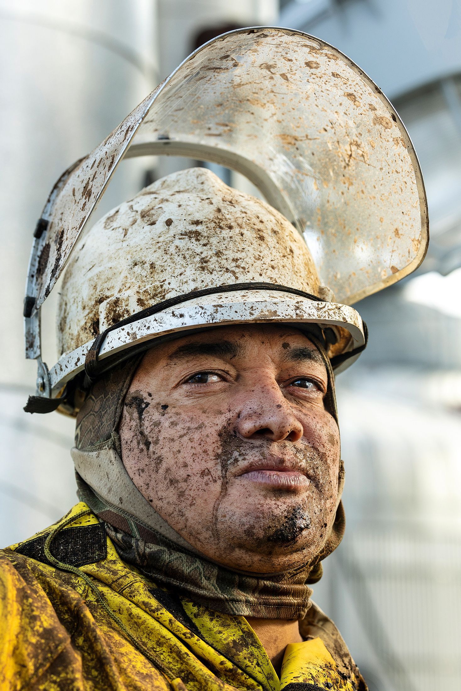 Industrial maintenance technician after completing heavy manufacturing facility repairs, showcasing authentic working conditions in industrial environments.