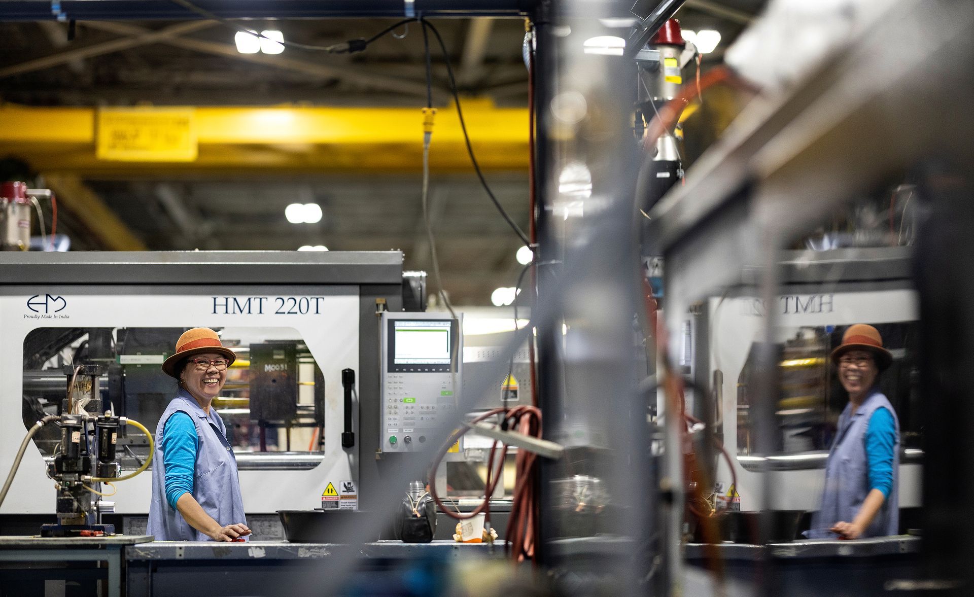 Happy worker in a plastics manufacturing facility.