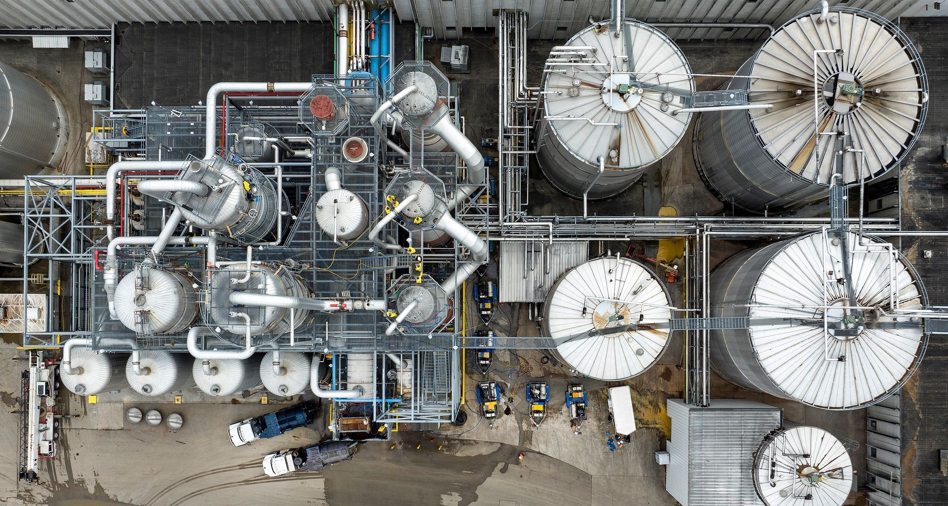 Aerial drone photography documenting extensive manufacturing facility operations, showcasing industrial scale and logistics infrastructure from an elevated perspective.
