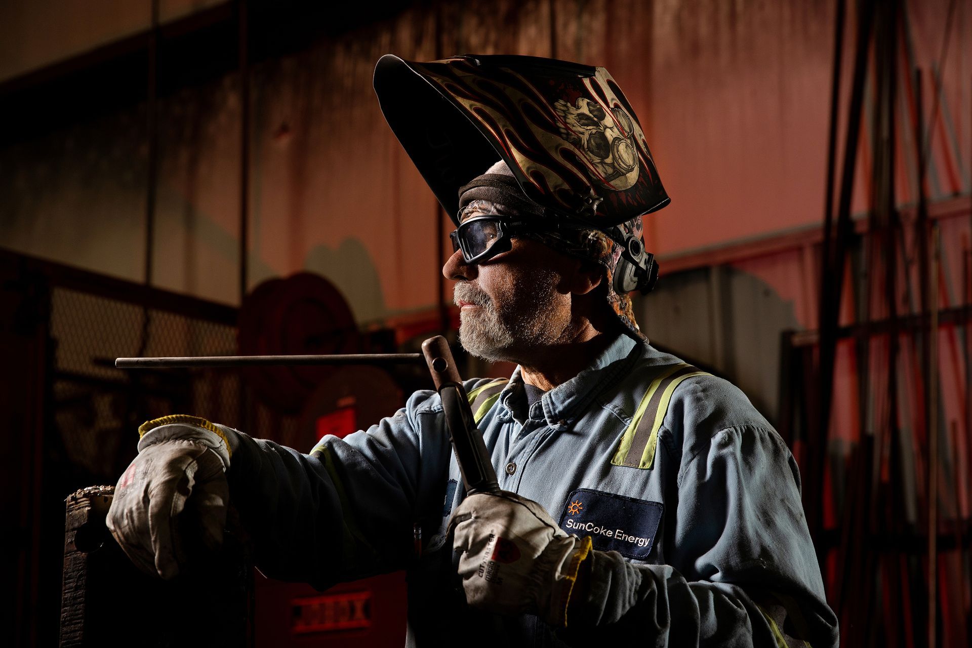 Manufacturing technician operating advanced production equipment.