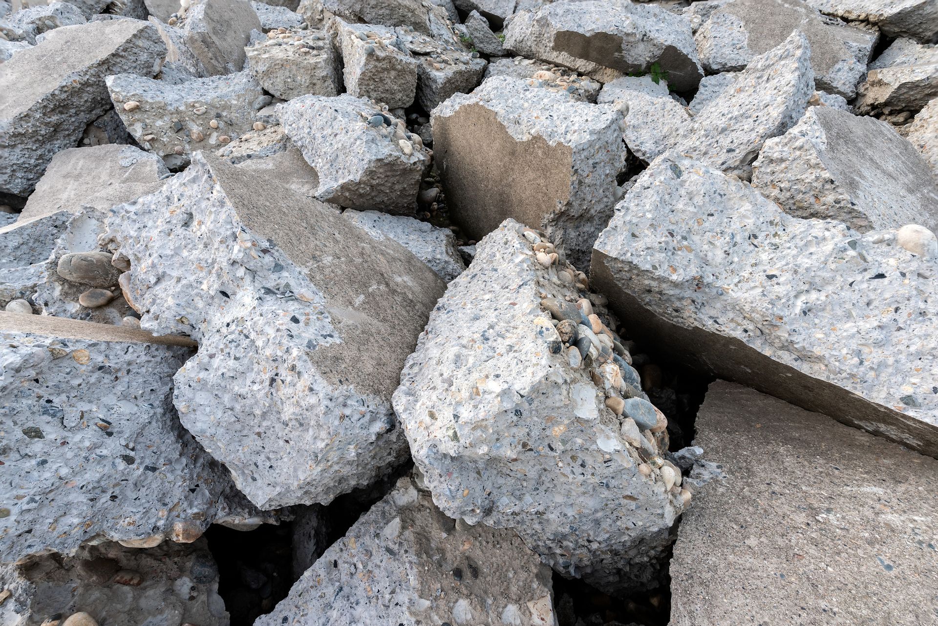 A pile of concrete blocks is sitting on the ground.
