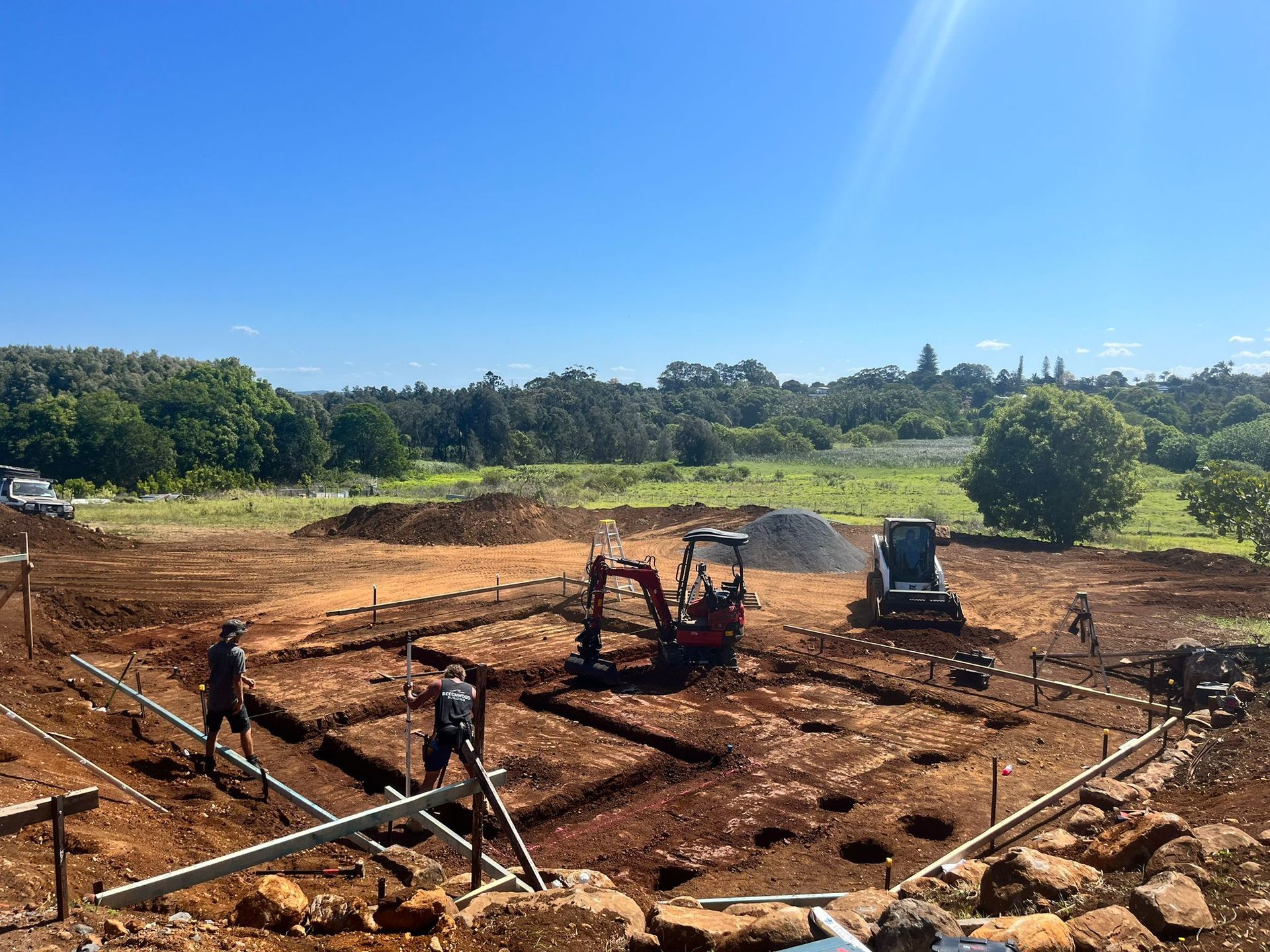 A group of construction workers are working on a large dirt field — ZBM Constructions in Wollongbar, NSW