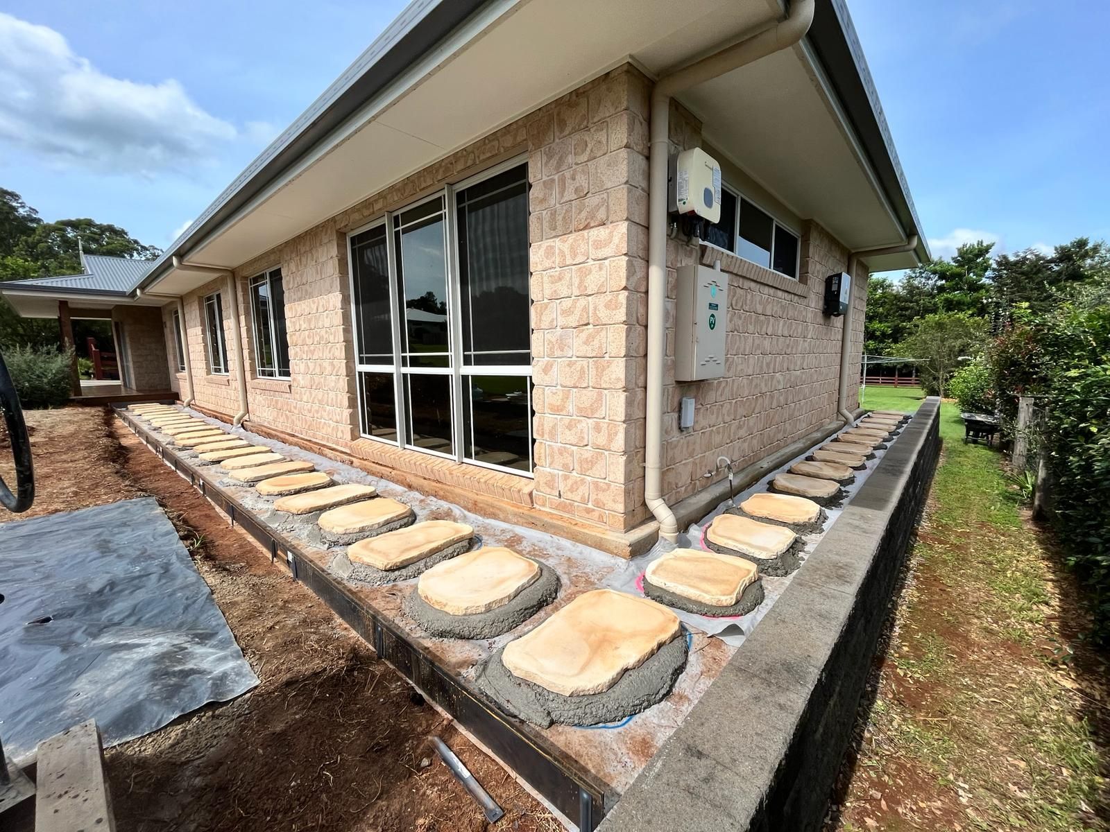 A brick house with a walkway in front of it — ZBM Constructions in Wollongbar, NSW