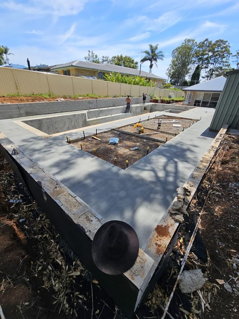 A Concrete Foundation Is Being Built in A Backyard — ZBM Constructions in Ballina, NSW