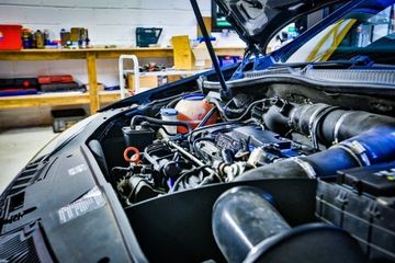 top view on car engine and parts under hood bonnet