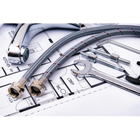 Metal plumbing pipes and flexible hoses on architectural blueprints with technical drawings