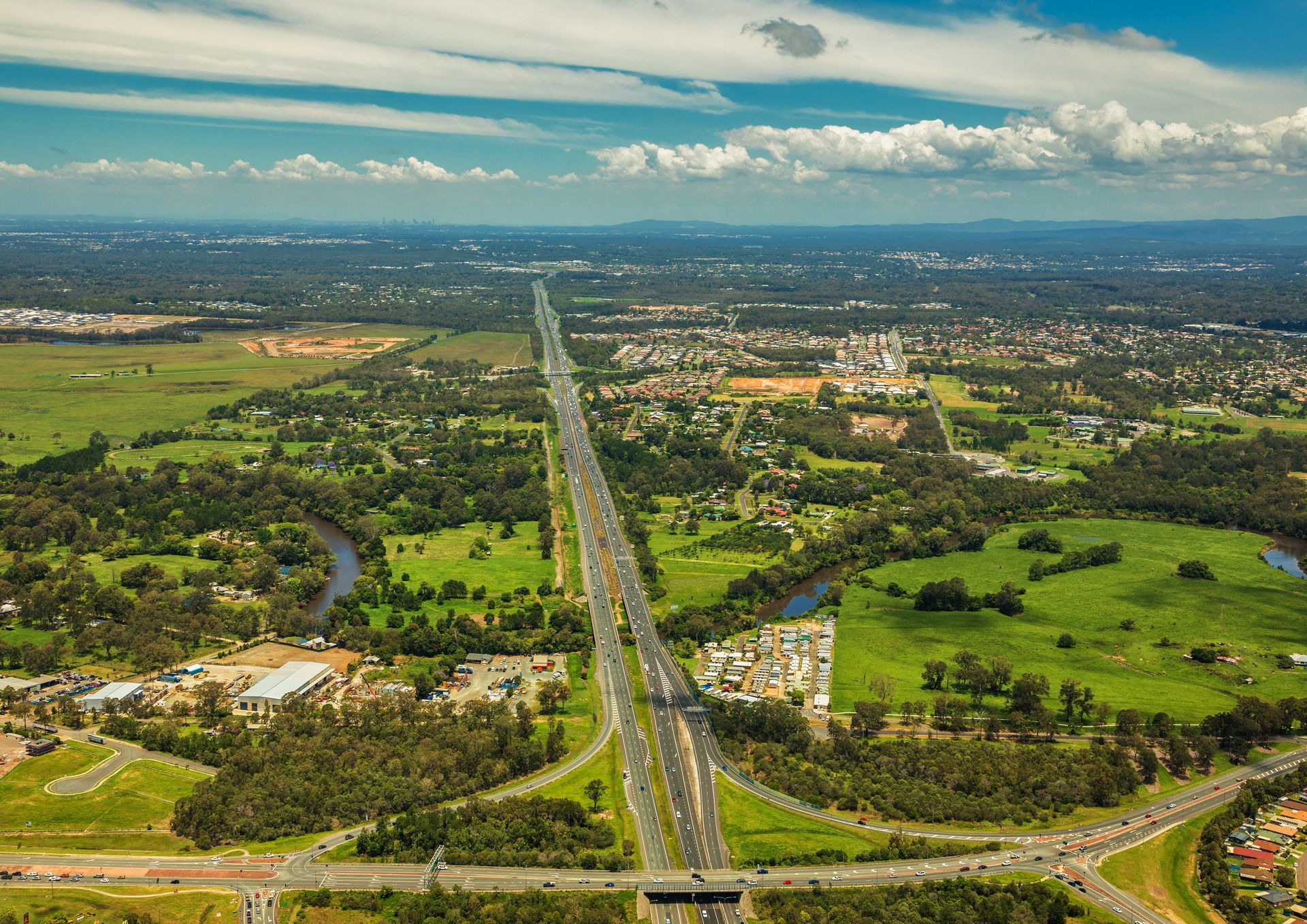 Aerial View of a Multi-lane Highway Cutting Through a Green Landscape — Cape York Accounting Smithfield in Aurukun, QLD