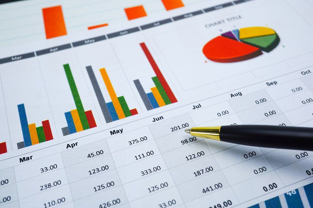 A Pen Is Sitting on Top of A Financial Chart — Cape York Accounting Smithfield in Seisia, QLD