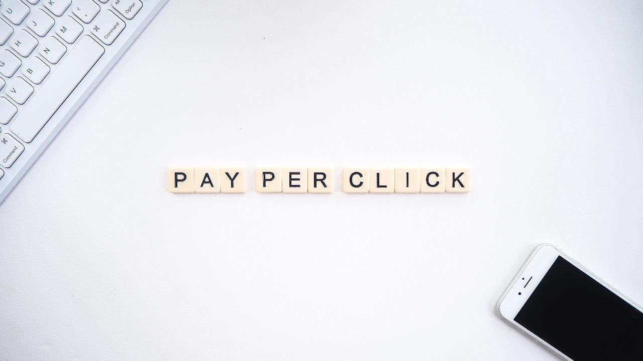 Pay per click spelt out with scrabble pieces.