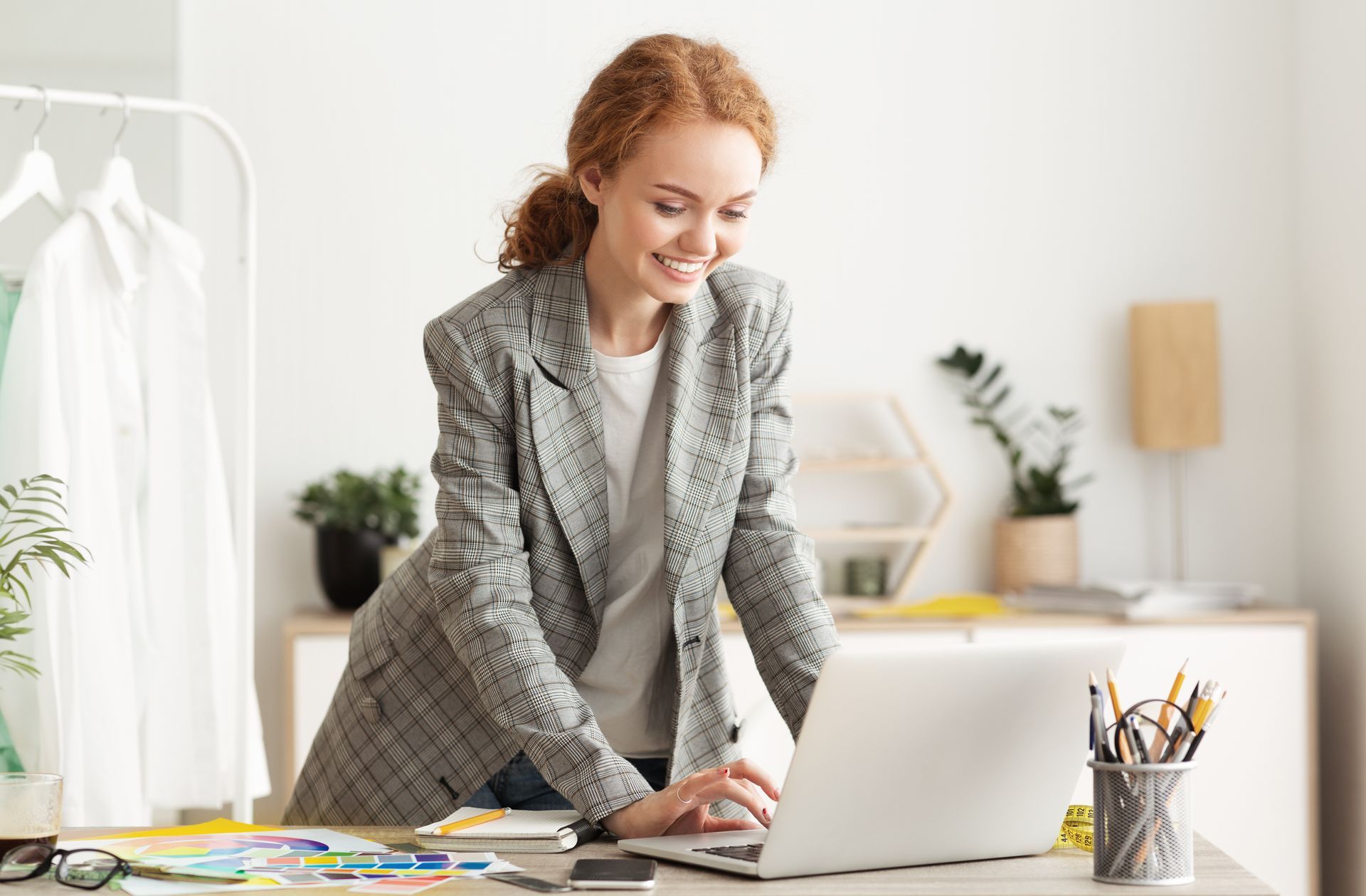 A smiling doctor at a desk replying to reviews