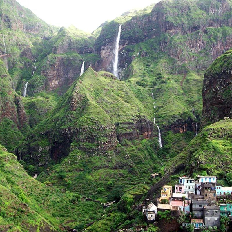 Experience canyoning in Cape Verde with Inspiration Africa. This image captures waterfalls cascading down green cliffs on Santo Antão, the archipelago’s top destination for canyoning adventures. The island’s deep ravines, natural pools, and seasonal waterfalls—most active from August to November—offer ideal terrain for rappelling, jumping, and climbing. Guided canyoning tours explore remote, lush valleys and hidden water routes shaped by volcanic landscapes. Inspiration Africa crafts tailor-made trips that include adventure activities like canyoning alongside cultural experiences and scenic hikes. Let us plan your journey into Cape Verde’s wilder side, where nature and adrenaline meet in unforgettable surroundings.
