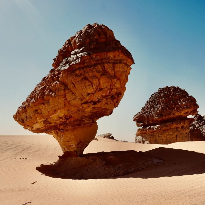 Gaze upon the vast, otherworldly beauty of the Tassili n’Ajjer and Hoggar region in southern Algeria. This striking desert landscape photograph captures sweeping sandstone formations, dramatic rock arches, and endless horizons shaped by wind and time. Renowned for its ancient rock art and surreal Saharan scenery, Tassili Hoggar offers a journey into one of Africa’s most remote and culturally rich regions. Exploring this desert wilderness is a profound and soul-stirring experience. Inspiration Africa specializes in crafting bespoke, tailor-made journeys that reveal Africa’s hidden landscapes, from Saharan deserts to extraordinary natural and cultural destinations across the continent.