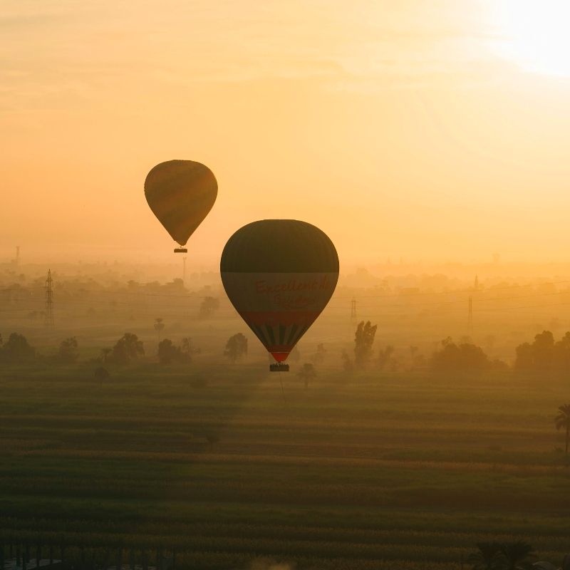 Sunrise hot air ballooning in Egypt captures Luxor at its most magical: the Nile glinting below, patchwork fields waking, and temples and the Valley of the Kings glowing gold. Drift silently above history for unforgettable photos and sweeping views. Inspiration Africa organizes tailor-made balloon experiences in Egypt, including trusted operators, early-morning transfers, safety-first briefings, and post-flight sightseeing with expert guides. Combine your flight with private tours of Karnak and Luxor Temple, a felucca sail at sunset, or a Nile cruise—seamlessly planned for comfort, timing, and wow-factor.