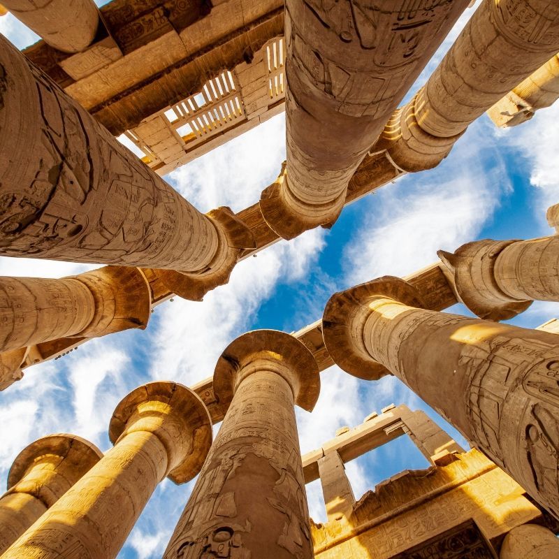 Gaze upon the awe-inspiring grandeur of the columns in a temple at Luxor, Egypt, captured in this striking photograph. The image highlights the scale, intricate carvings, and monumental architecture of one of the world’s most iconic ancient sites. Luxor’s temples reflect thousands of years of pharaonic history, offering a glimpse into the religious, cultural, and artistic achievements of ancient Egypt. Experiencing these colossal columns in person evokes wonder and a deep connection to history. Inspiration Africa specializes in designing bespoke, tailor-made journeys that combine extraordinary cultural encounters with Africa’s most remarkable archaeological destinations.