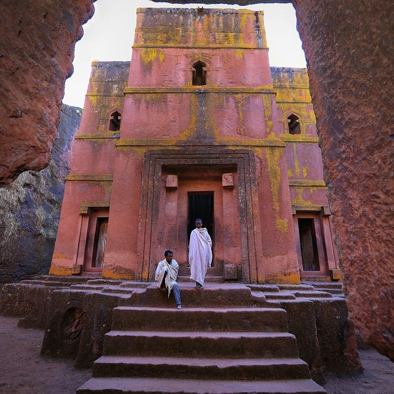 The remarkable rock-hewn churches of Lalibela in Ethiopia are captured in this evocative travel photograph, showcasing one of Africa’s most extraordinary architectural and spiritual treasures. Carved entirely from solid volcanic rock in the 12th century, these monolithic churches remain an active center of Ethiopian Orthodox worship and a UNESCO World Heritage Site. Linked by narrow passageways and sunken courtyards, the churches reflect remarkable craftsmanship, faith, and symbolism. Ideal for culture lovers, history enthusiasts, and photographers, Lalibela offers a profound journey into Ethiopia’s religious heritage and ancient traditions. Inspiration Africa specializes in bespoke, tailor-made journeys to Ethiopia and across Africa, crafting authentic travel experiences that connect visitors with iconic landmarks and timeless cultural history.