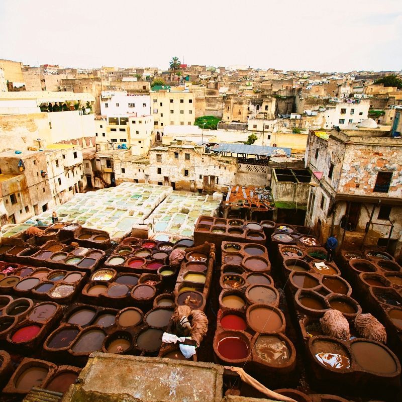 Gaze upon the vibrant and bustling Fes leather tanneries in Morocco, captured in this striking photograph. The image showcases rows of colorful dyeing vats, where traditional techniques have been used for centuries to create the city’s renowned leather goods. Artisans at work highlight the skill, dedication, and heritage behind this iconic craft, reflecting the rich cultural tapestry of Fes. Visiting the tanneries offers a rare and immersive insight into Morocco’s artisanal traditions. Inspiration Africa specializes in designing bespoke, tailor-made journeys that combine cultural exploration with extraordinary experiences across Africa’s most fascinating destinations.