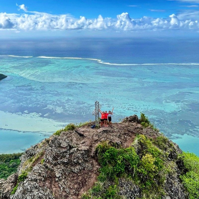 Hikers make their way along the trails of Le Morne Brabant in Mauritius, captured in this breathtaking adventure travel photograph. Rising dramatically above the turquoise waters of the Indian Ocean, Le Morne offers panoramic views of lush greenery, coral reefs, and pristine beaches, making it one of Mauritius’s most iconic landmarks. Trekking here combines physical challenge with stunning scenery, allowing travelers to explore tropical forests, rugged cliffs, and panoramic coastal vistas. Ideal for adventure seekers, nature enthusiasts, and photographers, this hike showcases the island’s unique blend of natural beauty and cultural heritage. Inspiration Africa specializes in bespoke, tailor-made journeys to Mauritius and across Africa, crafting authentic, unforgettable hiking and adventure experiences in extraordinary destinations.
