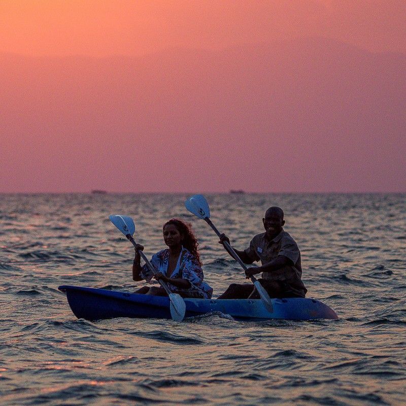 Tourists paddle kayaks across the shimmering waters of Lake Malawi at sunset, captured in this breathtaking adventure travel photograph. Bathed in warm golden light, the lake’s calm surface reflects the surrounding hills and distant shoreline, creating a serene and unforgettable scene. Kayaking in Lake Malawi allows travelers to immerse themselves in the natural beauty of one of Africa’s largest and most picturesque lakes, renowned for its crystal-clear waters, vibrant fish species, and tranquil atmosphere. Ideal for adventure seekers and nature lovers, this experience combines outdoor activity, stunning scenery, and peaceful exploration. Inspiration Africa crafts bespoke, tailor-made journeys to Malawi and across Africa, offering authentic, unforgettable experiences that connect travelers with extraordinary landscapes and wildlife.